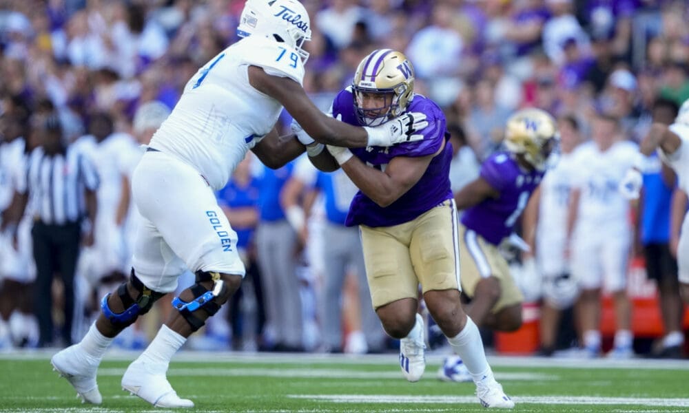 Washington edge Bralen Trice in action against Tulsa offensive lineman Darrell Simpson (79) during an NCAA college football game Saturday, Sept. 9, 2023, in Seattle. (AP Photo/Lindsey Wasson)