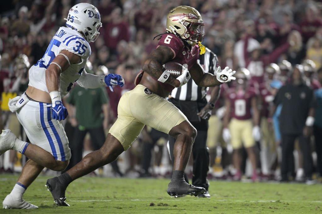 Florida State tight end Jaheim Bell (6) runs after catching a pass in front of Duke linebacker Cam Dillon (35) during the first half of an NCAA college football, Saturday, Oct. 21, 2023, in Tallahassee, Fla. (AP Photo/Phelan M. Ebenhack)