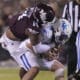 Kentucky quarterback Devin Leary (13) is sacked by Mississippi State linebacker Nathaniel Watson (14) during the second half of an NCAA college football game in Starkville, Miss., Saturday, Nov. 4, 2023. Kentucky won 24-3. (AP Photo/Rogelio V. Solis)