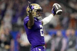 Washington wide receiver Ja'Lynn Polk (2) celebrates his touchdown against Texas during the first half of the Sugar Bowl CFP NCAA semifinal college football game, Monday, Jan. 1, 2024, in New Orleans. (AP Photo/Gerald Herbert)