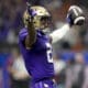 Washington wide receiver Ja'Lynn Polk (2) celebrates his touchdown against Texas during the first half of the Sugar Bowl CFP NCAA semifinal college football game, Monday, Jan. 1, 2024, in New Orleans. (AP Photo/Gerald Herbert)