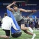 Kansas defensive lineman Austin Booker runs a drill at the NFL football scouting combine, Thursday, Feb. 29, 2024, in Indianapolis. (AP Photo/Michael Conroy)