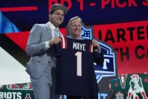 North Carolina quarterback Drake Maye poses with NFL commissioner Roger Goodell after being chosen by the New England Patriots with the third overall pick during the first round of the NFL Draft, Thursday, April 25, 2024, in Detroit. (AP Photo/Jeff Roberson)