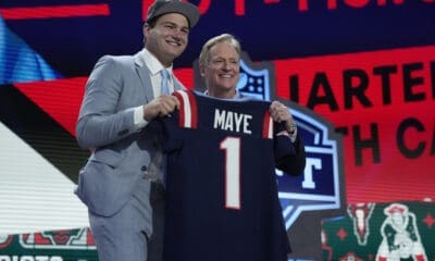 North Carolina quarterback Drake Maye poses with NFL commissioner Roger Goodell after being chosen by the New England Patriots with the third overall pick during the first round of the NFL Draft, Thursday, April 25, 2024, in Detroit. (AP Photo/Jeff Roberson)