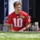 New England Patriots quarterback Drake Maye (10) steps on the field for an NFL football practice, Wednesday, May 29, 2024, in Foxborough, Mass. (AP Photo/Steven Senne)