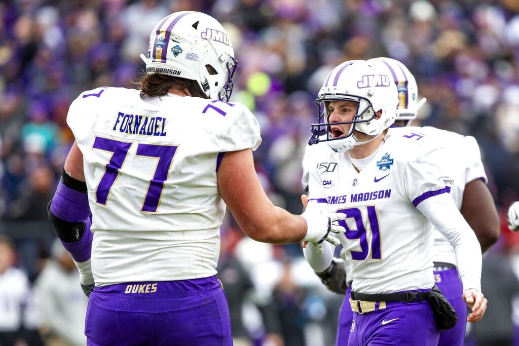 James Madison place kicker Ethan Ratke (91) is congratulated by offensive lineman Liam Fornadel (77) after kicking an extra point during the first half of the FCS championship NCAA college football game against North Dakota State, Saturday, Jan. 11, 2020, in Frisco, Texas. Fornadel has signed with the New England Patriots. (AP Photo/Sam Hodde)