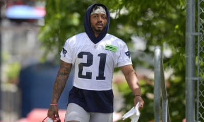 New England Patriots running back Antonio Gibson (21) steps on the field for an NFL football practice, Wednesday, May 29, 2024, in Foxborough, Mass. (AP Photo/Steven Senne)