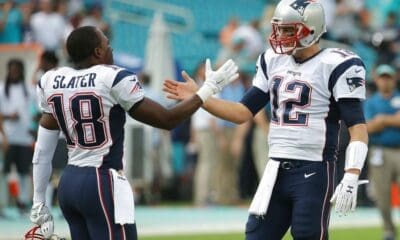 New England Patriots quarterback Tom Brady (12) greets wide receiver Matthew Slater (18) on the field before an NFL football game against the Miami Dolphins, Sunday, Jan. 3, 2016 in Miami Gardens, Fla. (AP Photo/Lynne Sladky)