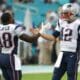 New England Patriots quarterback Tom Brady (12) greets wide receiver Matthew Slater (18) on the field before an NFL football game against the Miami Dolphins, Sunday, Jan. 3, 2016 in Miami Gardens, Fla. (AP Photo/Lynne Sladky)