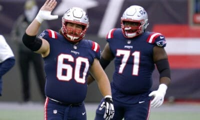 New England Patriots center David Andrews, left, and offensive lineman Mike Onwenu, right, warm up before an NFL football game against the San Francisco 49ers, Monday, Oct. 26, 2020, in Foxborough, Mass. (AP Photo/Charles Krupa)