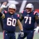 New England Patriots center David Andrews, left, and offensive lineman Mike Onwenu, right, warm up before an NFL football game against the San Francisco 49ers, Monday, Oct. 26, 2020, in Foxborough, Mass. (AP Photo/Charles Krupa)