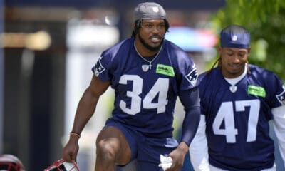 New England Patriots safety Dell Pettus (34) and cornerback Mikey Victor (47) step on the field for an NFL football practice, Wednesday, May 29, 2024, in Foxborough, Mass. (AP Photo/Steven Senne)