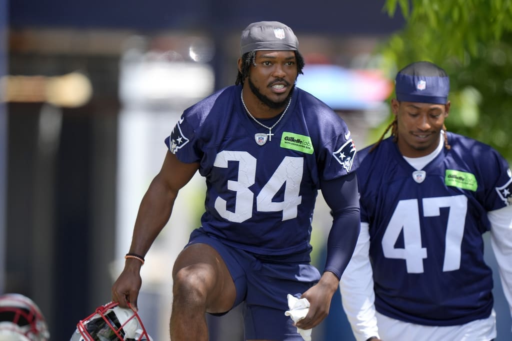 New England Patriots safety Dell Pettus (34) and cornerback Mikey Victor (47) step on the field for an NFL football practice, Wednesday, May 29, 2024, in Foxborough, Mass. (AP Photo/Steven Senne)