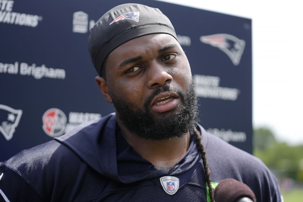 New England Patriots defensive tackle Armon Watts faces reporters following an NFL football practice, Tuesday, June 4, 2024, in Foxborough, Mass. (AP Photo/Steven Senne)