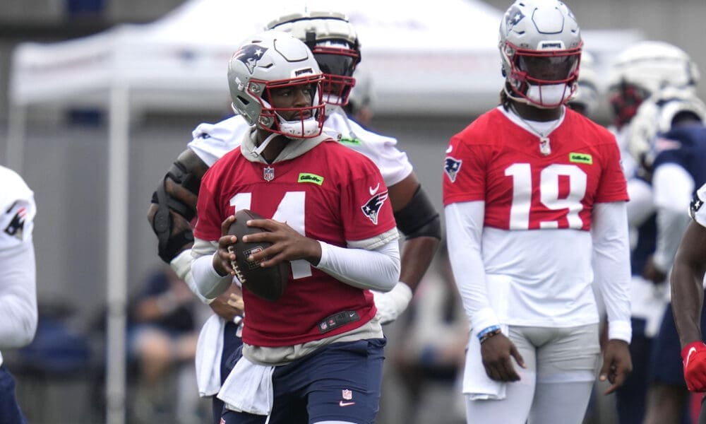 New England Patriots quarterback Jacoby Brissett, left, during an NFL football training camp, Thursday, July 25, 2024, in Foxborough, Mass. (AP Photo/Charles Krupa)