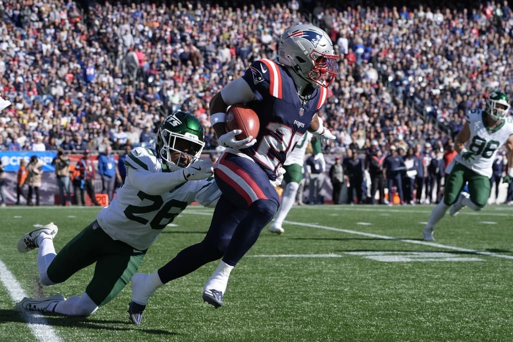 New England Patriots cornerback Marcus Jones, right, is pursued by New York Jets cornerback Brandin Echols, left, in the first half of an NFL football game, Sunday, Oct. 27, 2024, in Foxborough, Mass. (AP Photo/Michael Dwyer)