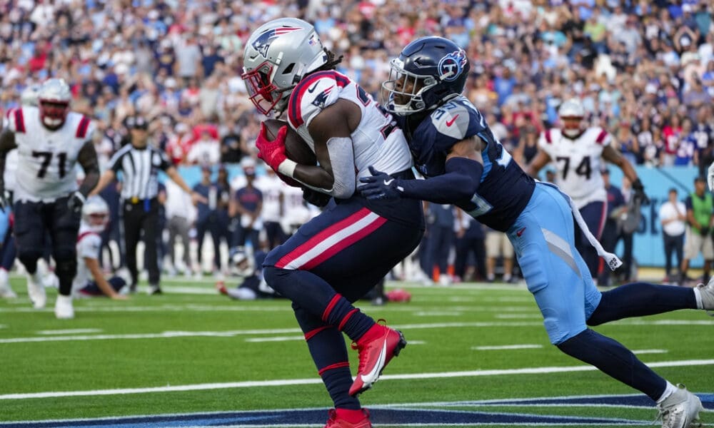 New England Patriots running back Rhamondre Stevenson (38) makes a catch in front of Tennessee Titans cornerback Darrell Baker Jr. (39) for a touchdown at the end of the fourth quarter of an NFL football game in Nashville, Tenn., Sunday, Nov. 3, 2024. (AP Photo/George Walker IV)