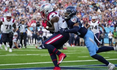 New England Patriots running back Rhamondre Stevenson (38) makes a catch in front of Tennessee Titans cornerback Darrell Baker Jr. (39) for a touchdown at the end of the fourth quarter of an NFL football game in Nashville, Tenn., Sunday, Nov. 3, 2024. (AP Photo/George Walker IV)