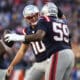 New England Patriots offensive tackle Vederian Lowe (59) is congratulated by quarterback Drake Maye after scoring a touchdown against the Los Angeles Rams during the second half of an NFL football game, Sunday, Nov. 17, 2024, in Foxborough, Mass. (AP Photo/Michael Dwyer)