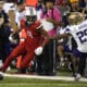 Arizona wide receiver Tetairoa McMillan (4 )runs away from Washington cornerback Elijah Jackson (25) during the first half of an NCAA college football game, Saturday, Sept. 30, 2023, in Tucson, Ariz. (AP Photo/Rick Scuteri)