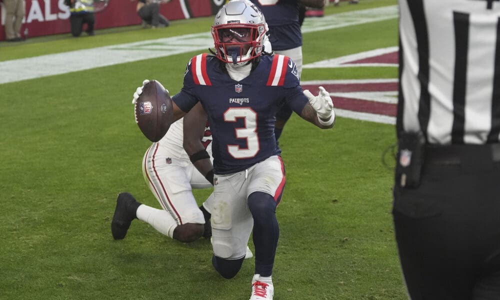 New England Patriots wide receiver DeMario Douglas celebrates his touchdown against the Arizona Cardinals during the second half of an NFL football game, Sunday, Dec. 15, 2024, in Glendale, Ariz. (AP Photo/Ross D. Franklin)