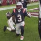 New England Patriots wide receiver DeMario Douglas celebrates his touchdown against the Arizona Cardinals during the second half of an NFL football game, Sunday, Dec. 15, 2024, in Glendale, Ariz. (AP Photo/Ross D. Franklin)