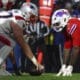 New England Patriots center Ben Brown (77) and Buffalo Bills defensive tackle DaQuan Jones (92) line up on the line of scrimmage during the first half of an NFL football game in Orchard Park, N.Y., Sunday Dec. 22, 2024. (AP Photo/ Jeffrey T. Barnes)