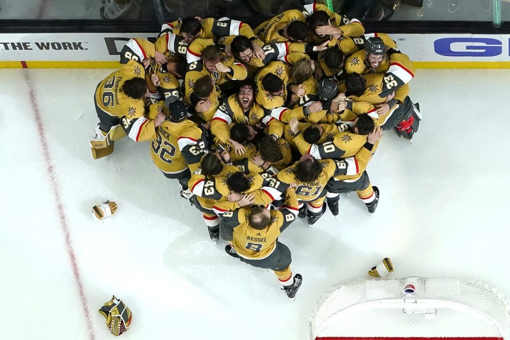 Members of the Vegas Golden Knights celebrate after they defeated the Florida Panthers 9-3 to win the Stanley Cup in Game 5 of the NHL hockey Stanley Cup Finals Tuesday, June 13, 2023, in Las Vegas. (AP Photo/Abbie Parr)