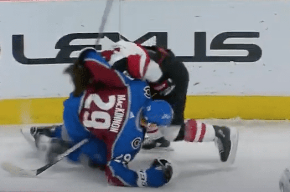 Nathan MacKinnon throws helmet at Conor Garland